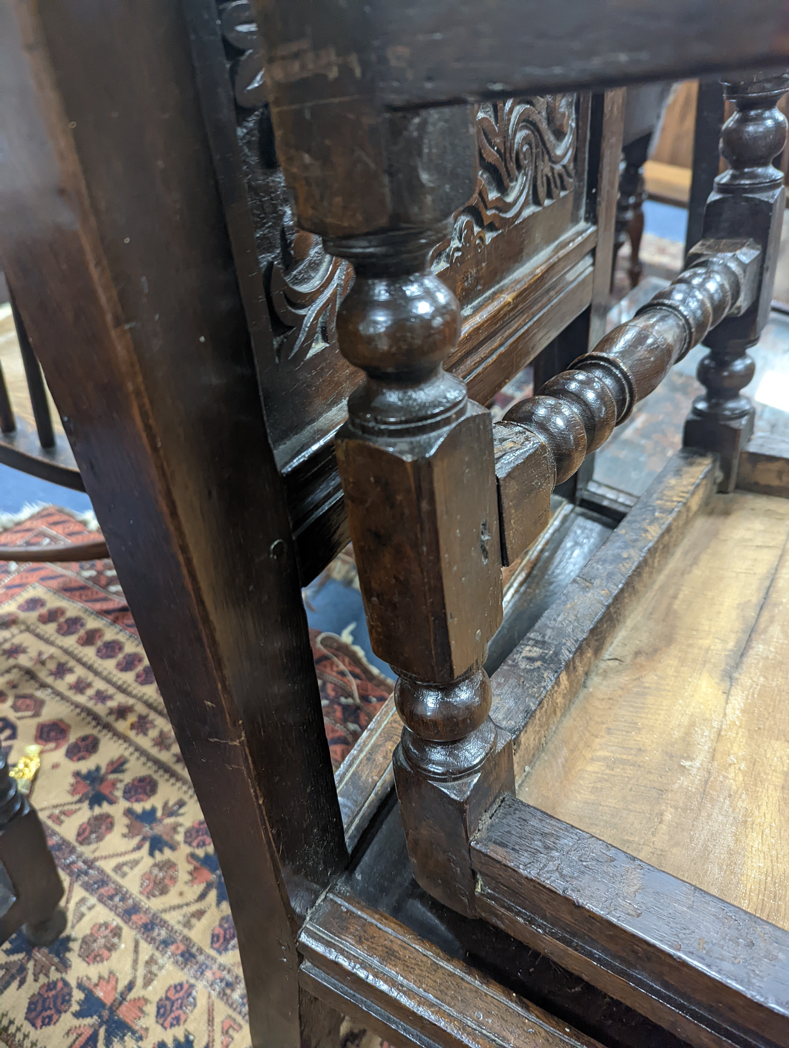 A pair of 17th century Lancashire carved oak side chairs, width 45cm, depth 39cm, height 101cm